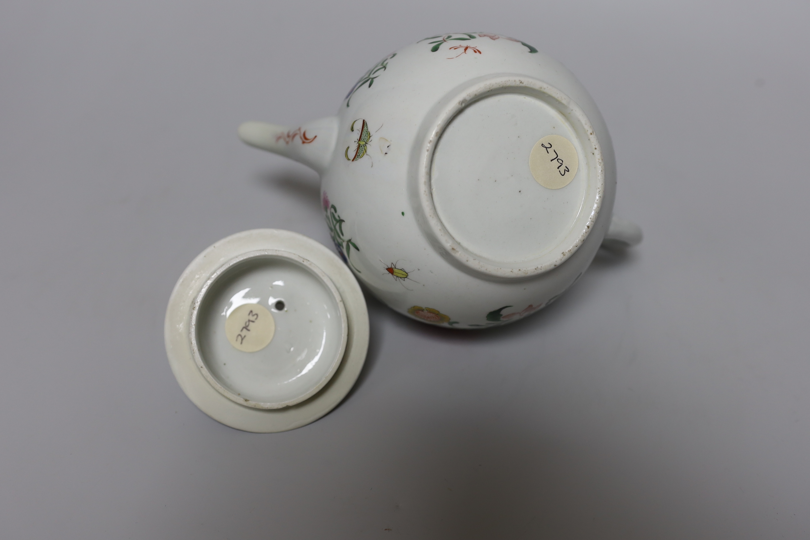 A Worcester teapot and cover, painted with Chinese style flowers and winged insects, c.1770, 14cm tall